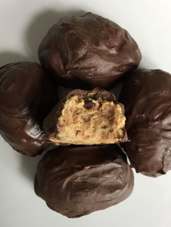 Looking for edible protein cookie dough? Try this five ingredient protein paleo cookie dough - 5 minutes to make, no bake, egg-free, and vegan protein balls with NO refined sugar! This creamy, smooth, and deliciously rich recipe is filled with protein and is paleo, low carb, vegan, paleo, gluten free, dairy free, and sugar free, and so festive for Easter! Check it out now! #glutenfree #vegan #healthy #lowcarb #cookiedough #paleo